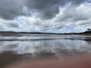 mirror image of the clouds reflected in the water at Exmouth